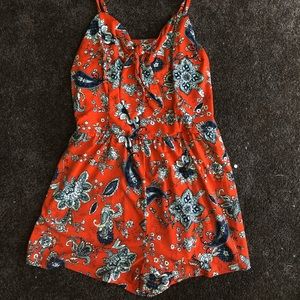 Orange with teal accent romper